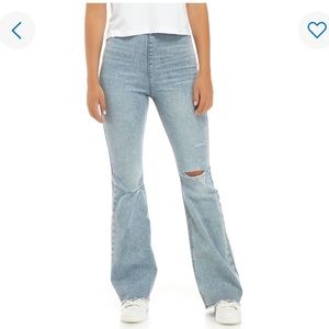 Distressed flare jeans with hole in the knee. New with tags